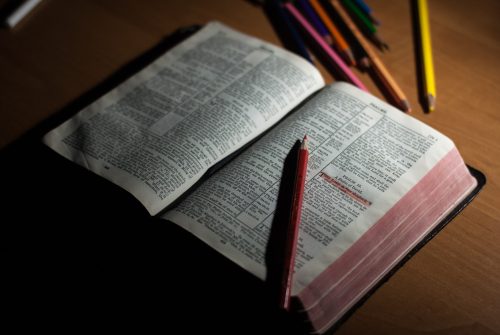 Photo by John-Mark Smith: https://www.pexels.com/photo/pink-pencil-on-open-bible-page-and-pink-272337/